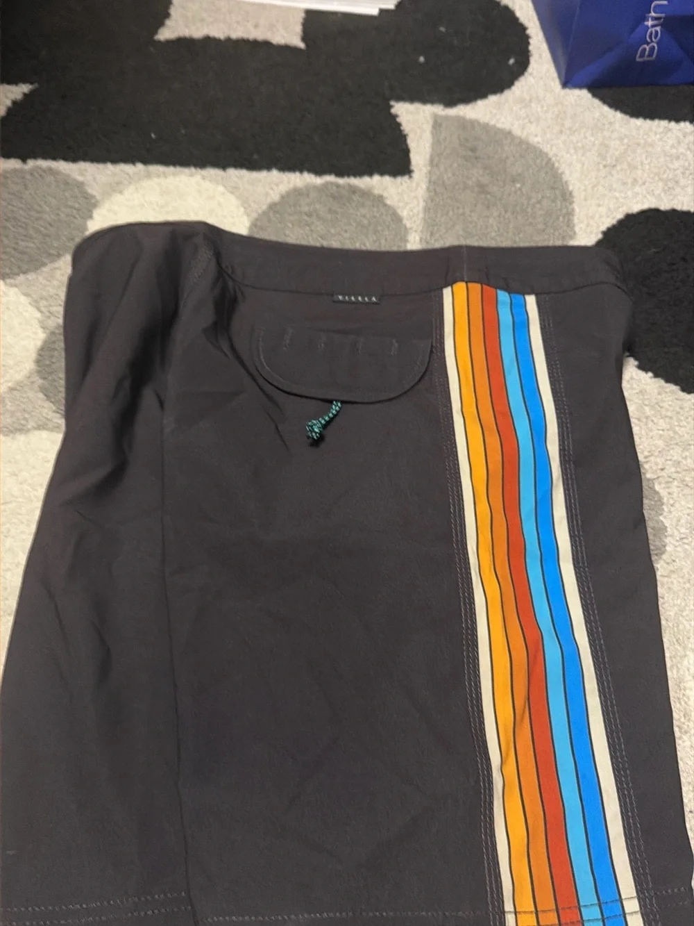 VISSLA Black Mini Skirt with Orange and Blue Stripe Panel